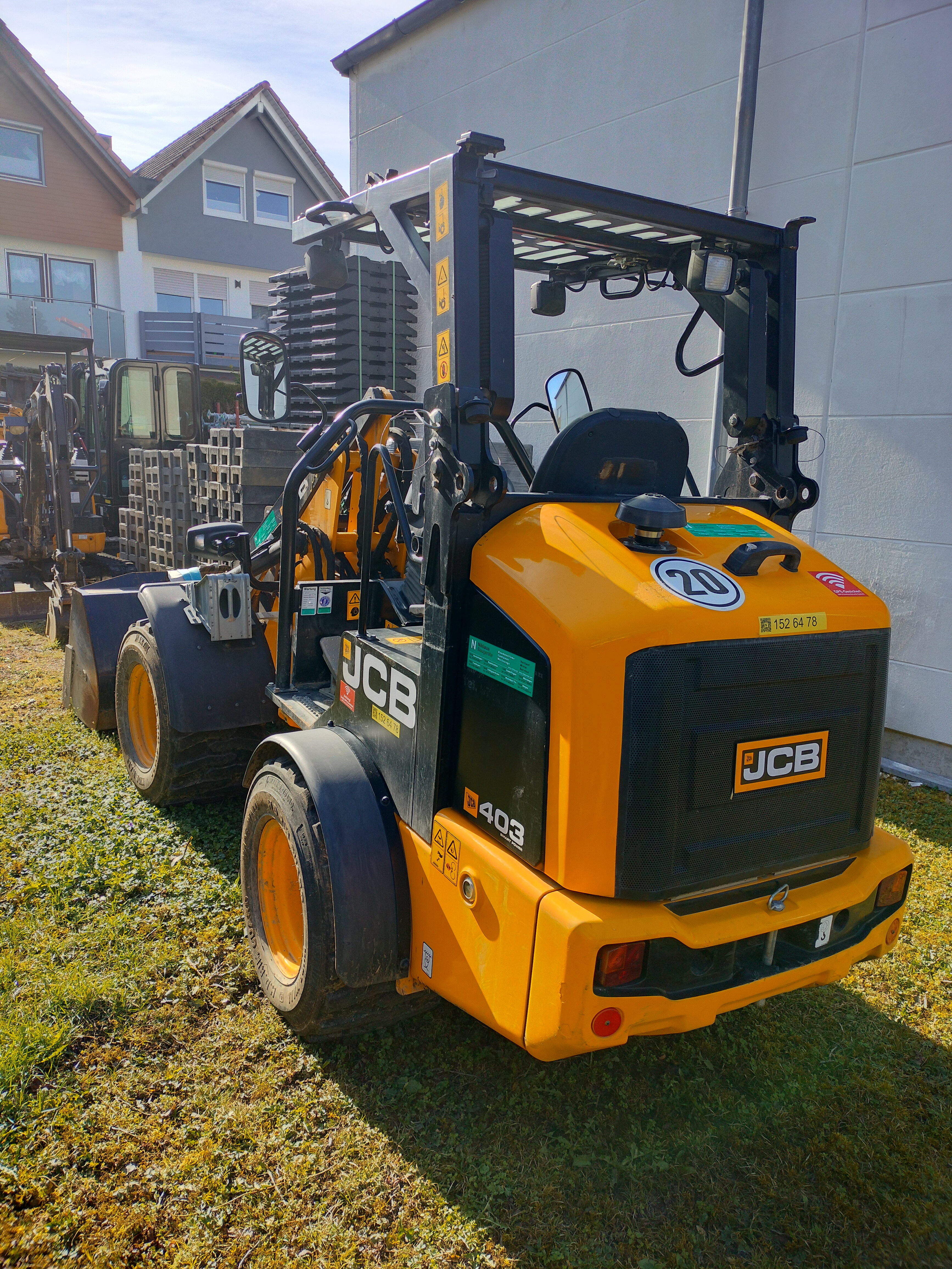 Hoflader JCB 403 von hinten